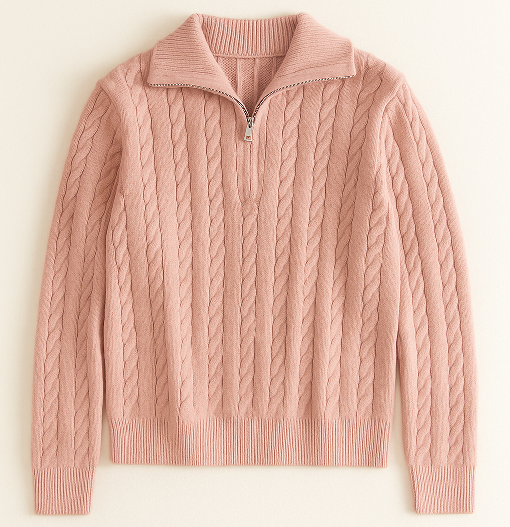 Pink cable knit sweater on a light beige background