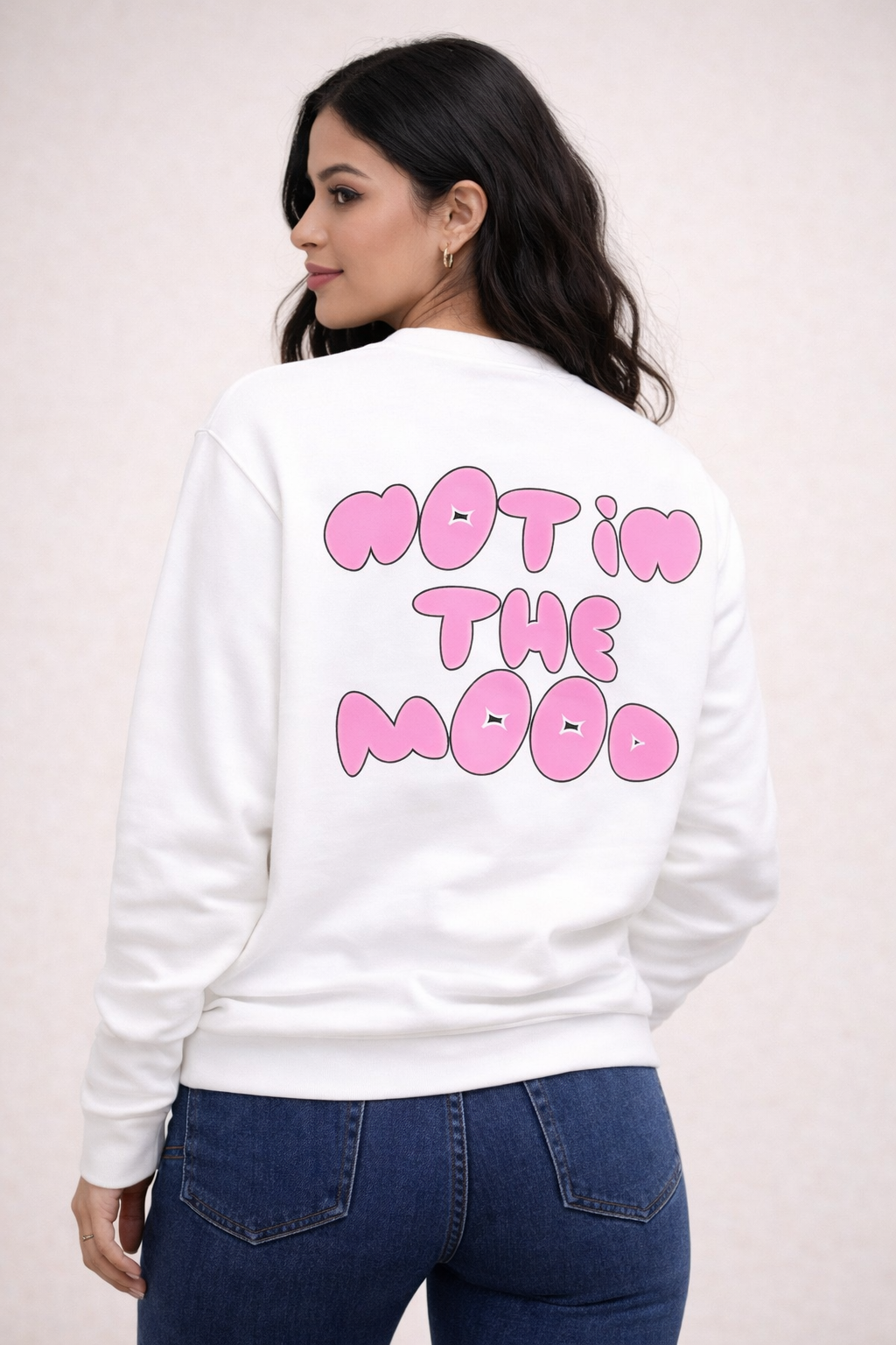 White graphic sweatshirt with pink heart front detail and “Not In The Mood” back print